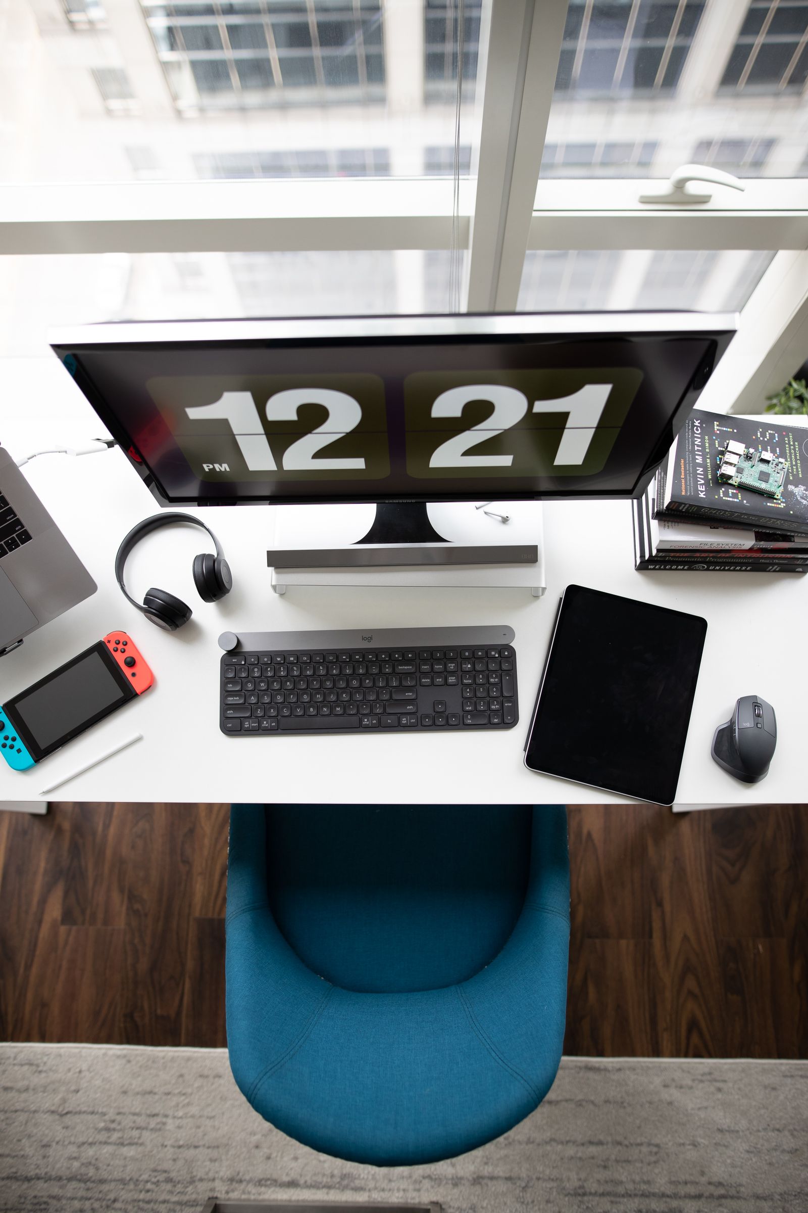 A desktop monitor, keyboard, and workspace show a separate-screen setup for everyday computer tasks.