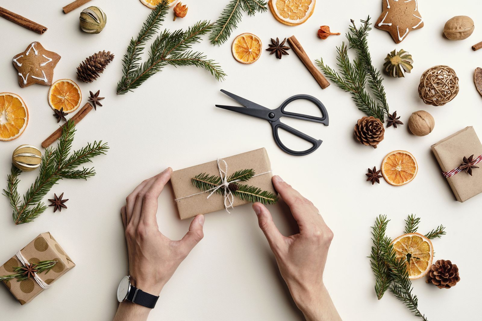A wrapped present being prepared by hand, a reminder that a thoughtful note can make a simple gift feel personal.